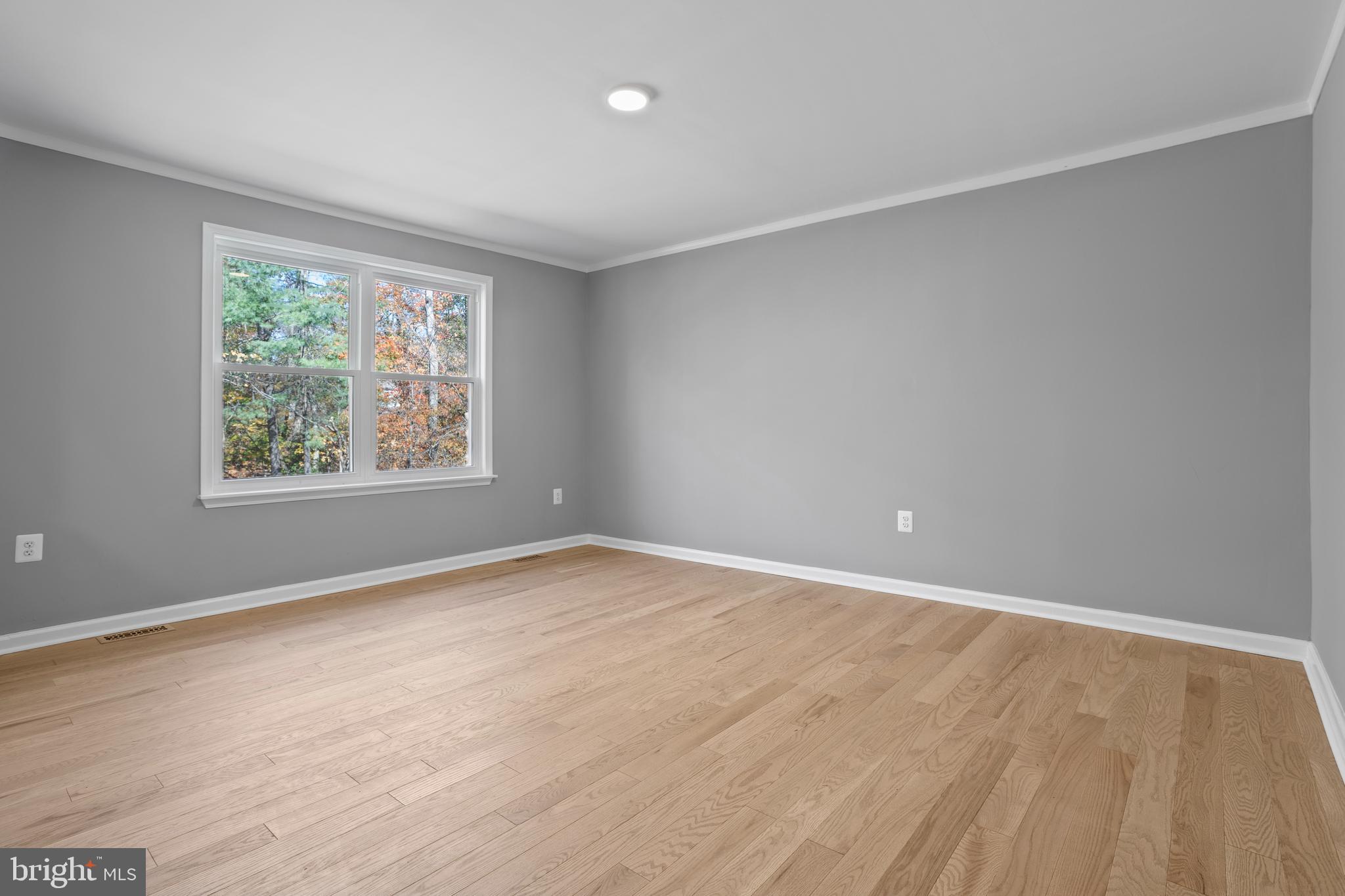 7410 Dakota Avenue Chesapeake Beach, MD 20732 - Photo 15 of 68 wooden floor in an empty room with a window