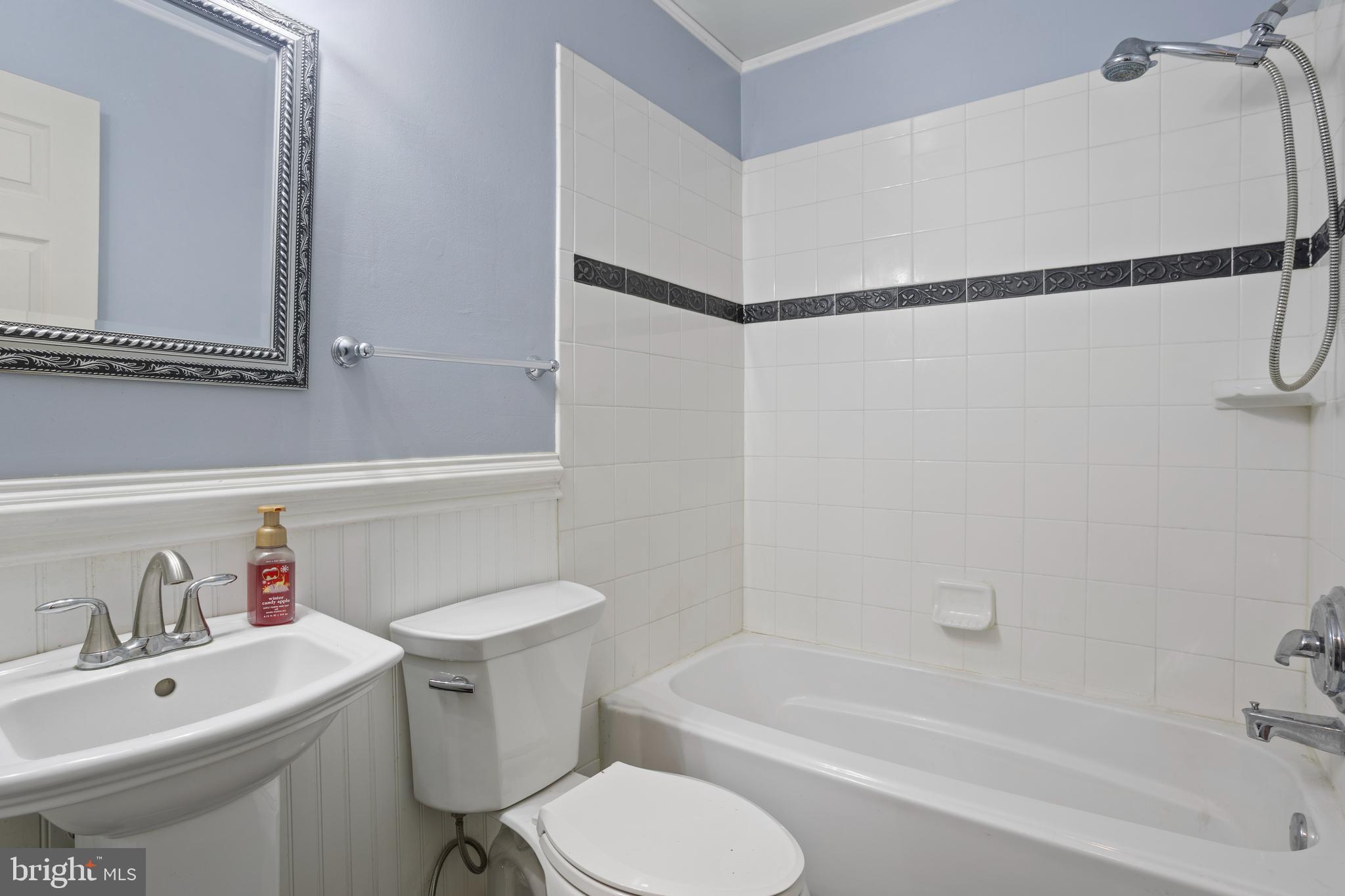 7410 Dakota Avenue Chesapeake Beach, MD 20732 - Photo 24 of 68 a bathroom with a sink toilet and shower