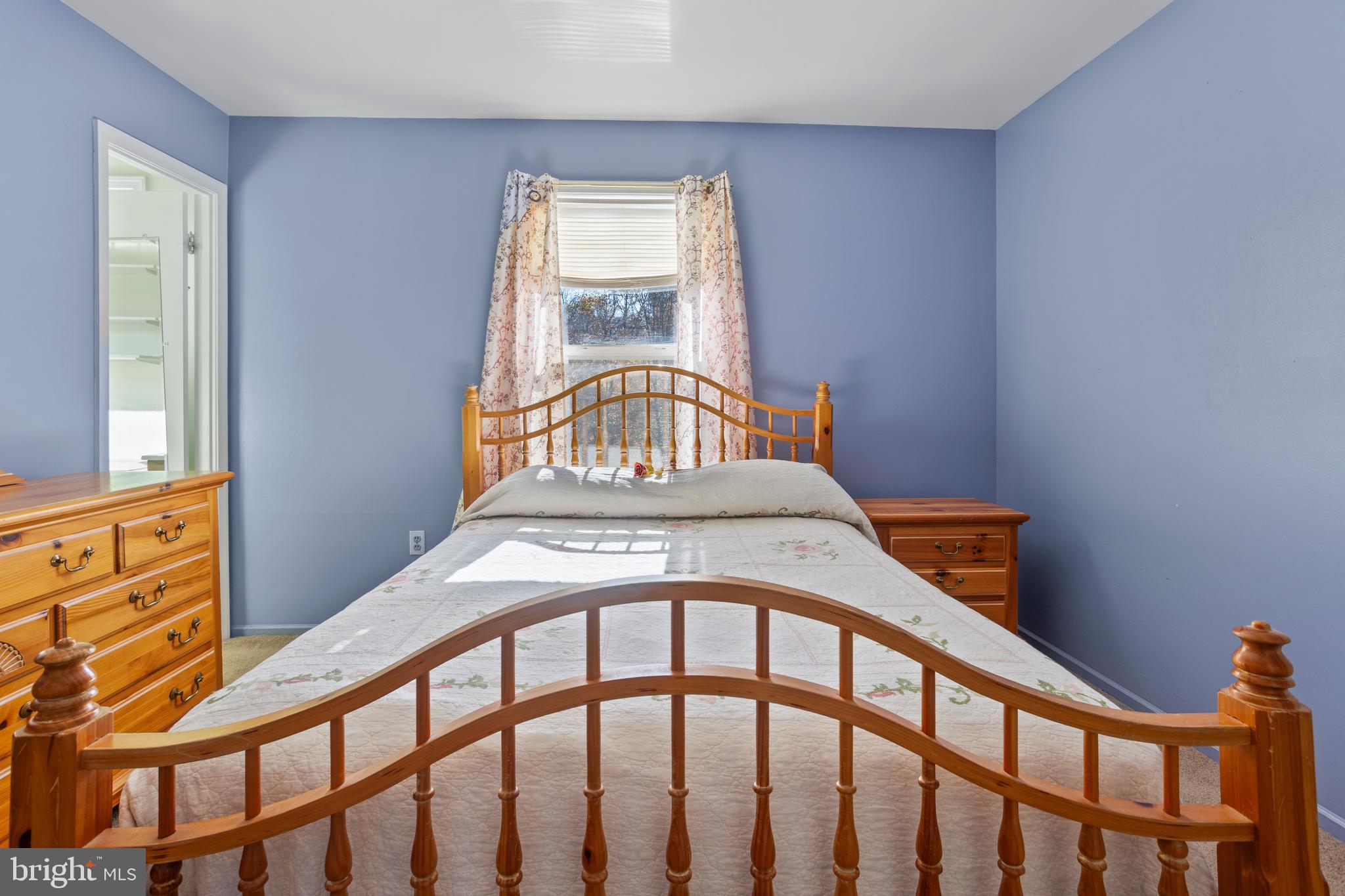 7410 Dakota Avenue Chesapeake Beach, MD 20732 - Photo 28 of 68 a bedroom with a bed and a window