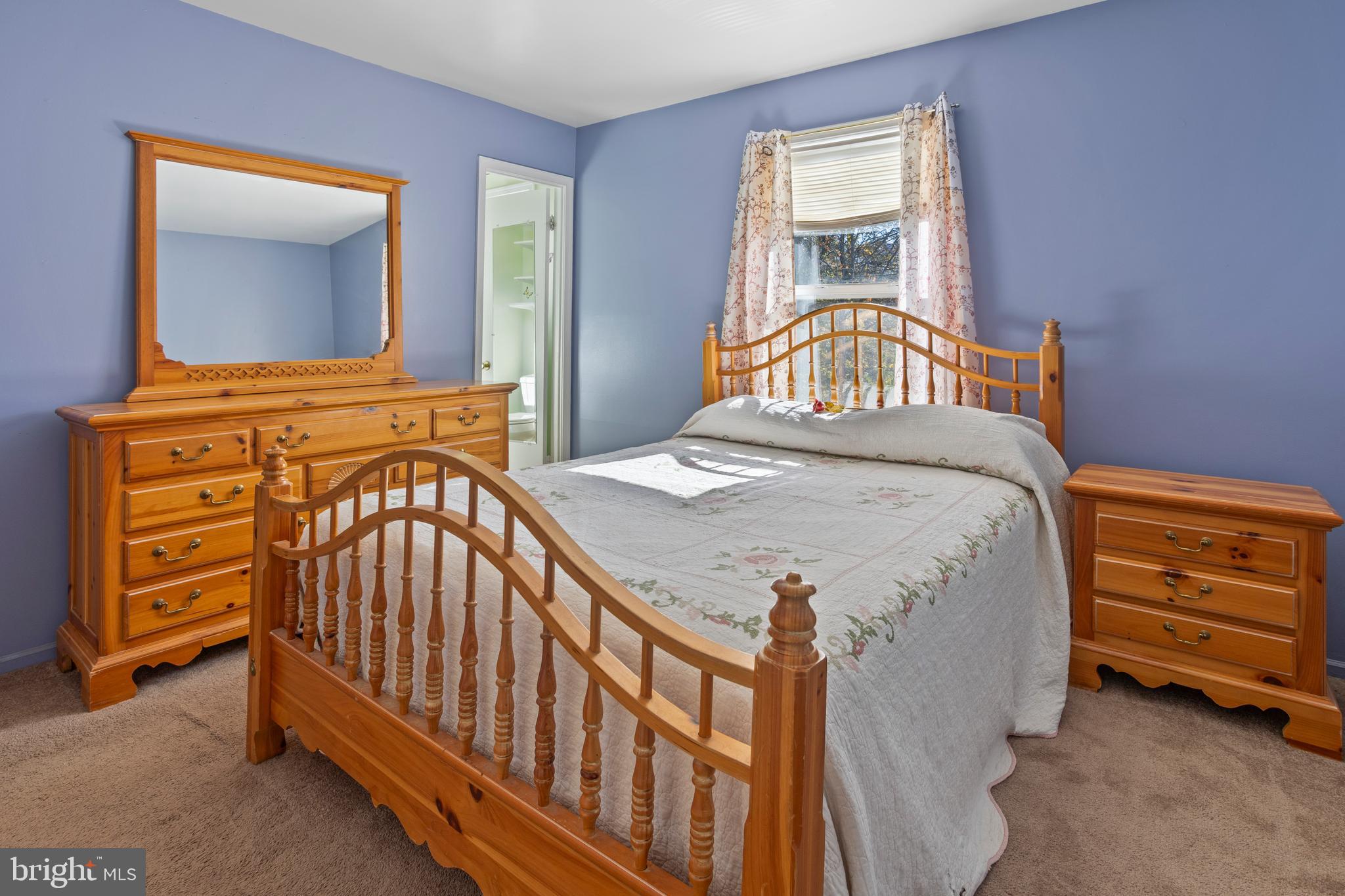 7410 Dakota Avenue Chesapeake Beach, MD 20732 - Photo 29 of 68 a bedroom with a bed and a dresser