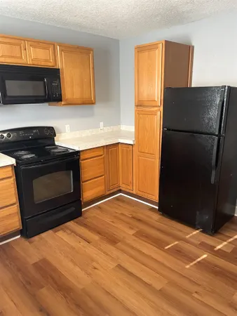 a kitchen with a refrigerator stove and a sink