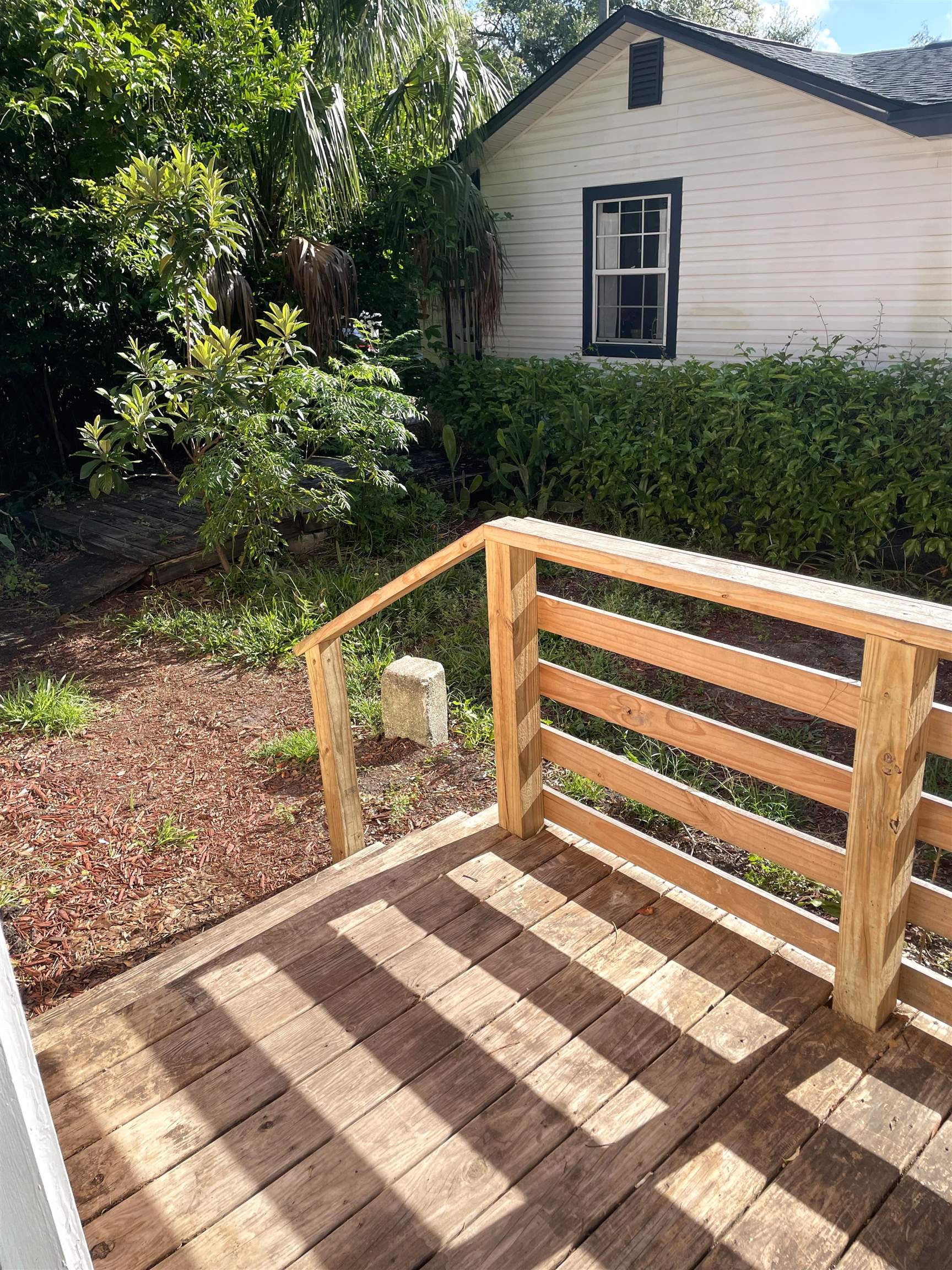9 Blanche Lane St. Augustine, FL 32084 - Photo 14 of 15 a view of backyard with deck and garden