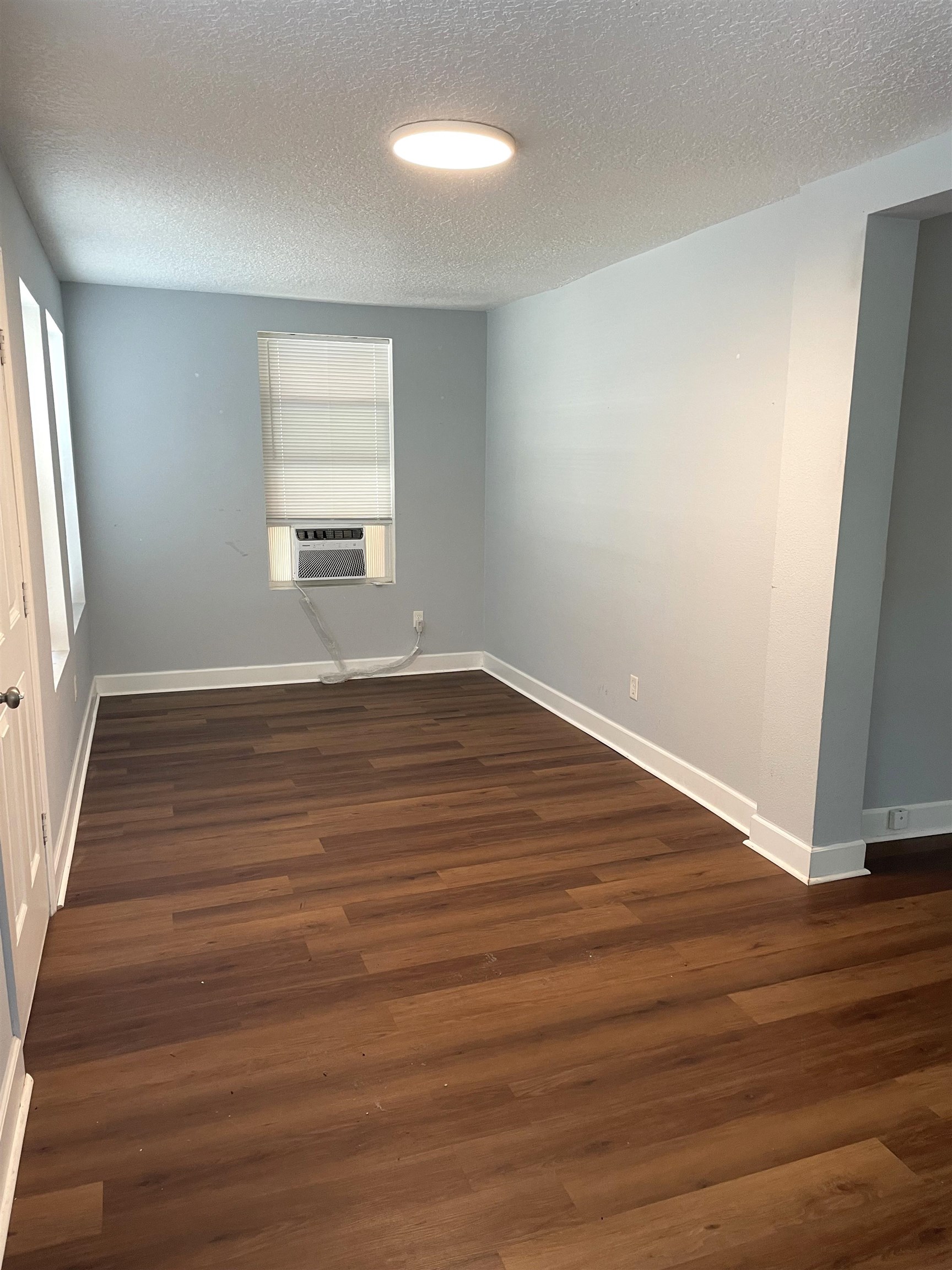 9 Blanche Lane St. Augustine, FL 32084 - Photo 3 of 15 an empty room with wooden floor and windows