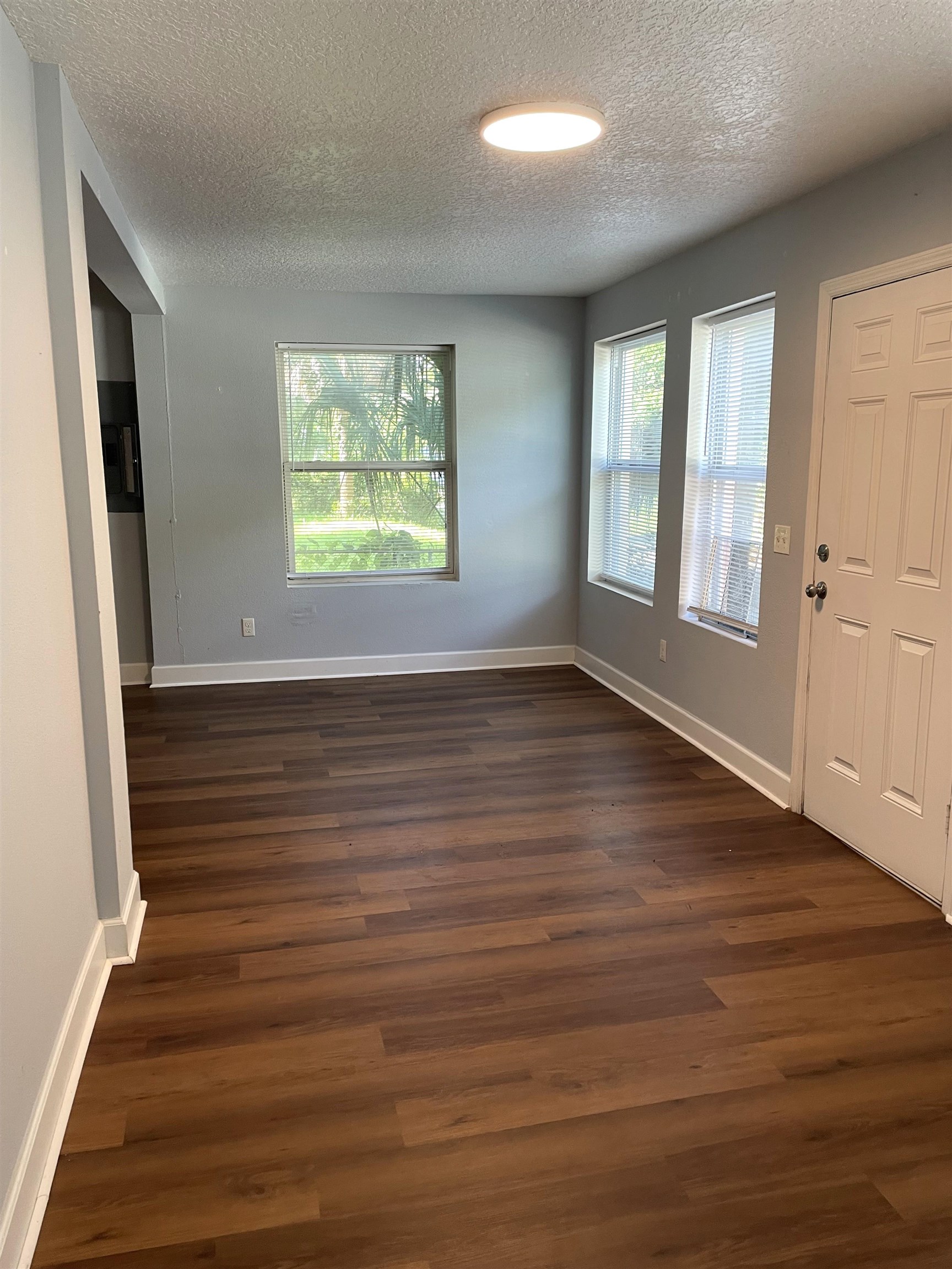 9 Blanche Lane St. Augustine, FL 32084 - Photo 4 of 15 an empty room with wooden floor and windows