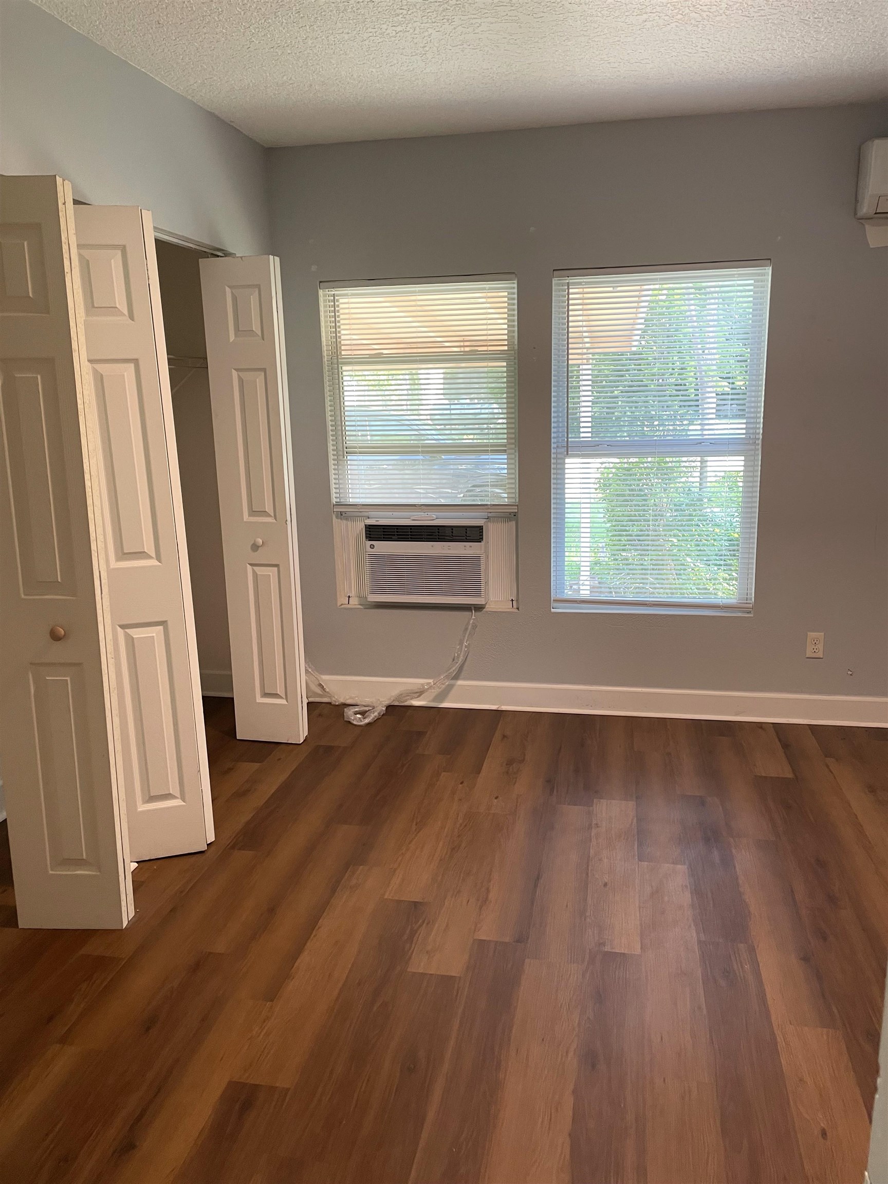 9 Blanche Lane St. Augustine, FL 32084 - Photo 6 of 15 an empty room with wooden floor and windows