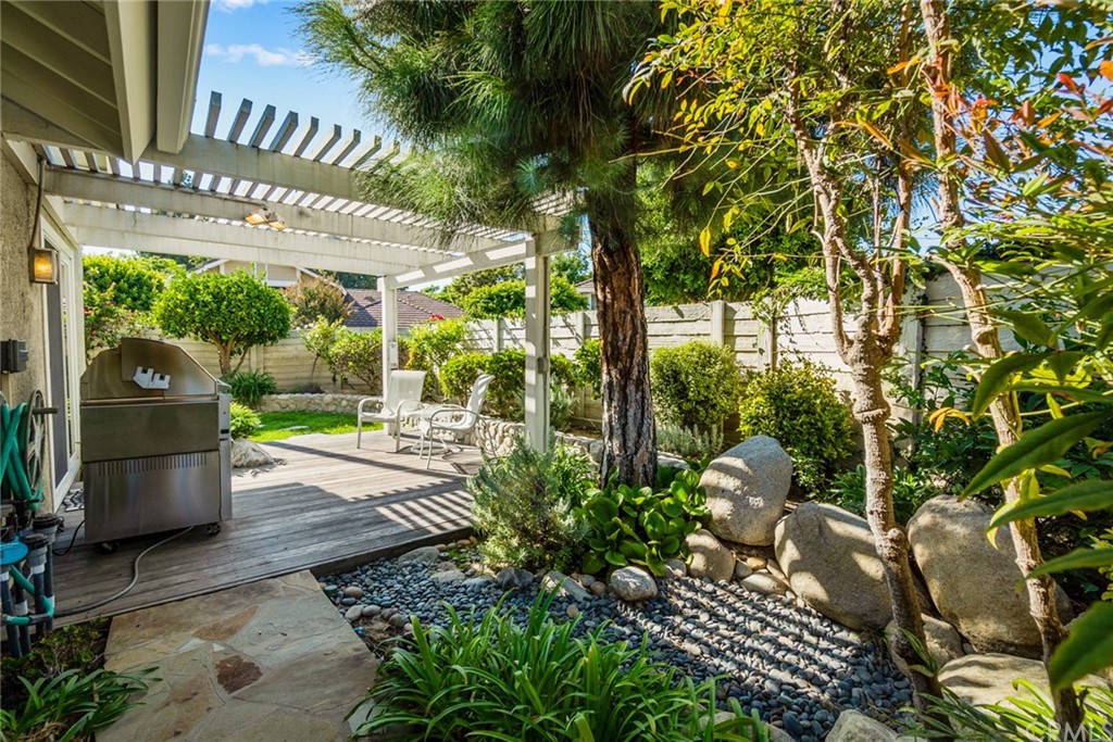5 Elderwood, Unit 19 Irvine, CA 92614 - Photo 20 of 39 a view of a chairs and table in backyard