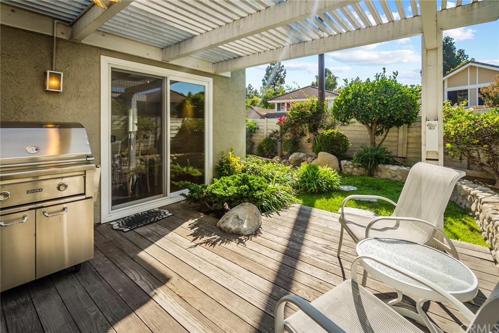 5 Elderwood, Unit 19 Irvine, CA 92614 - Photo 21 of 39 a view of a patio with table and chairs and potted plants