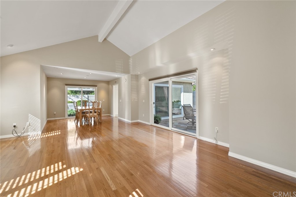 5 Elderwood, Unit 19 Irvine, CA 92614 - Photo 4 of 39 a view of a livingroom with wooden floor and furniture