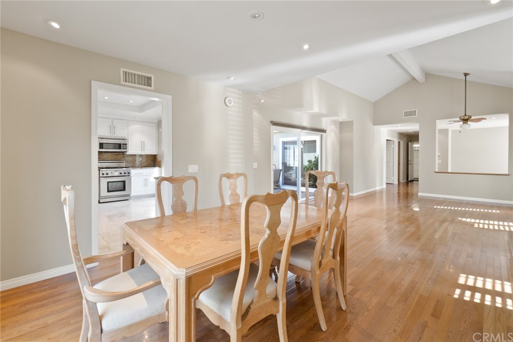 5 Elderwood, Unit 19 Irvine, CA 92614 - Photo 10 of 39 a dining room with furniture and wooden floor