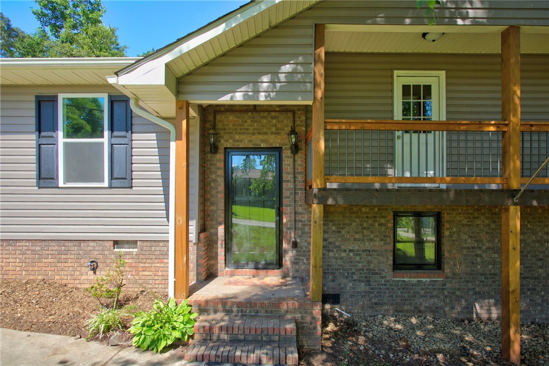712 Beech Drive Seneca, SC 29678 - Photo 2 of 41 A split-level home with an inviting entry and an elevated deck for outdoor enjoyment.