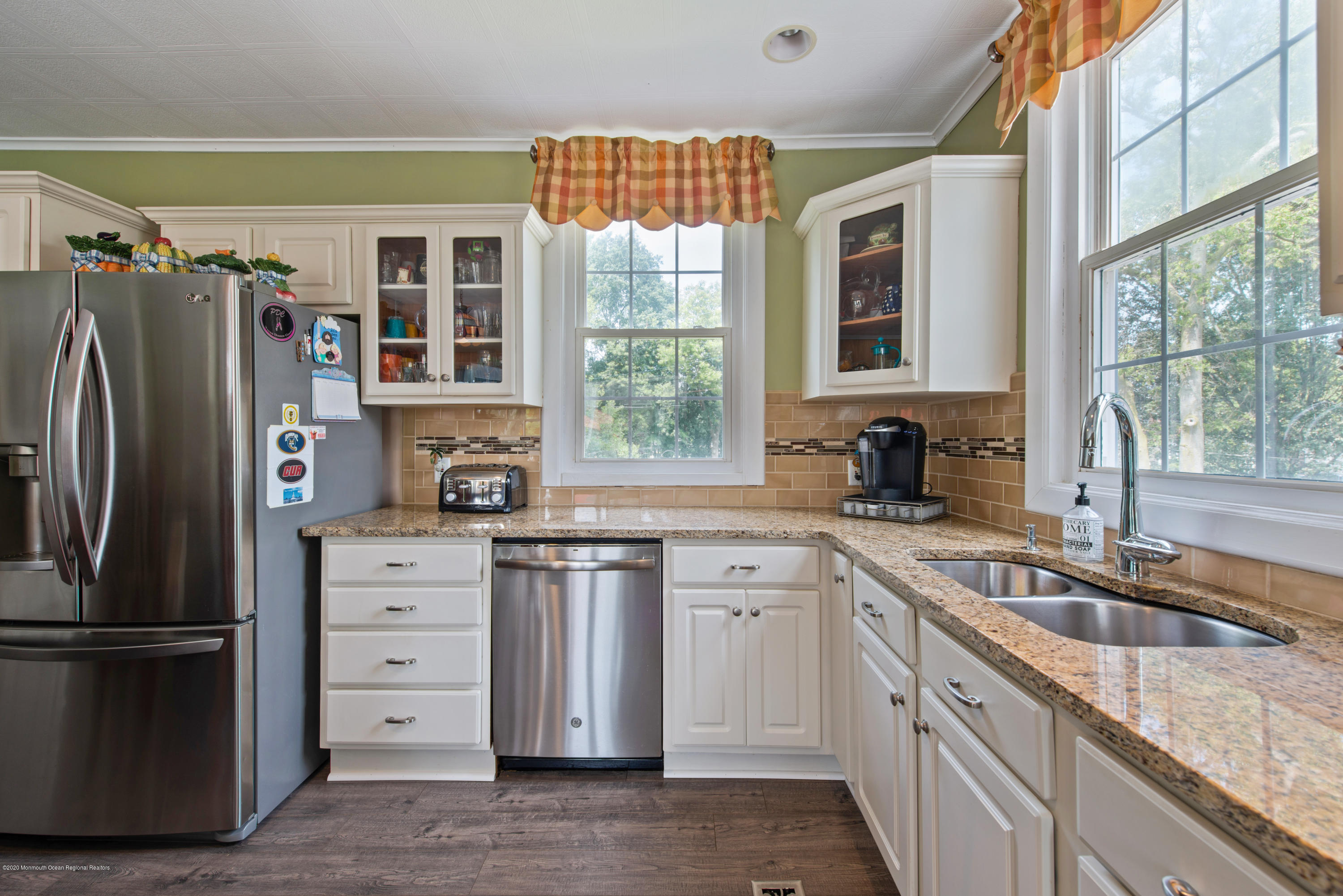 205 Main Street Keyport, NJ 07735 - Photo 11 of 42 a kitchen that has a sink a window and stainless steel appliances