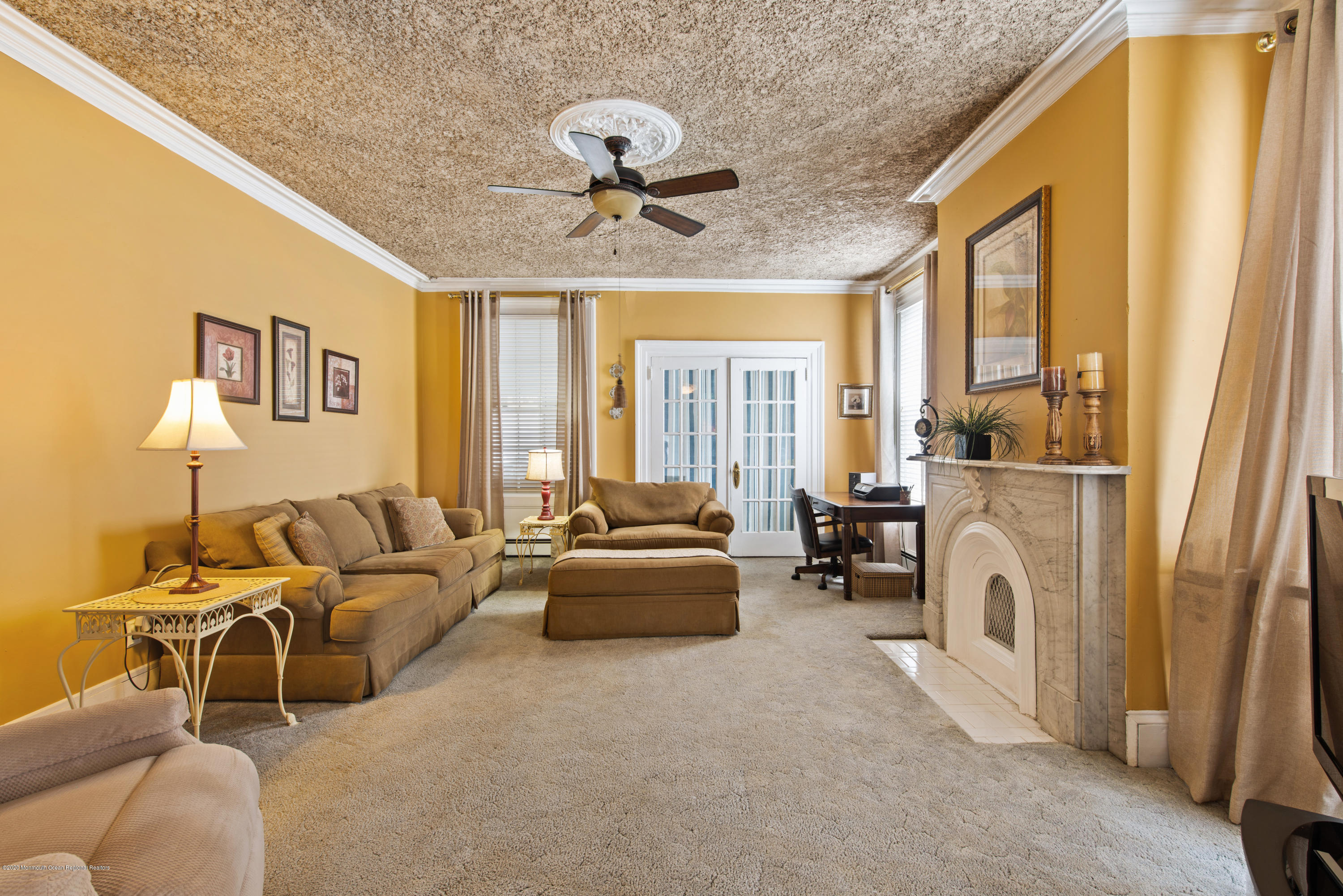 205 Main Street Keyport, NJ 07735 - Photo 14 of 42 a living room with furniture and a fireplace