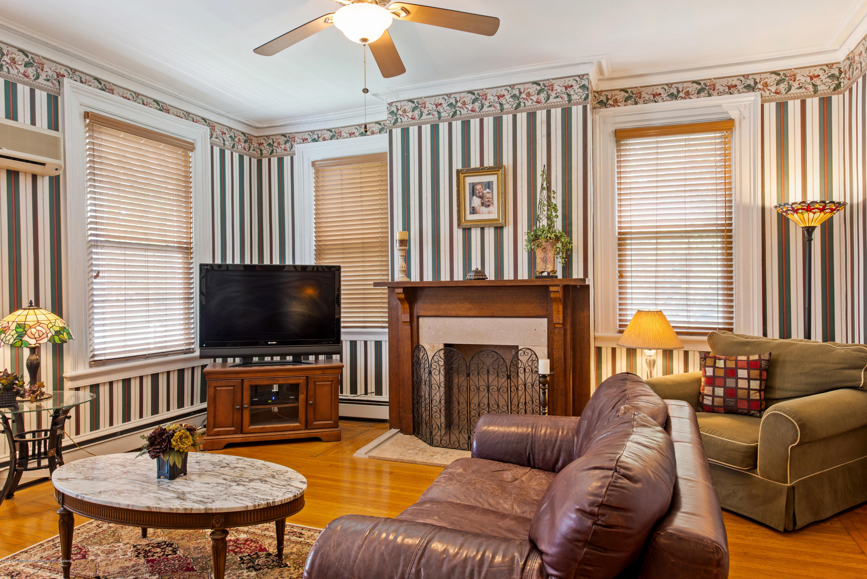 205 Main Street Keyport, NJ 07735 - Photo 22 of 42 a living room with fireplace furniture and a flat screen tv
