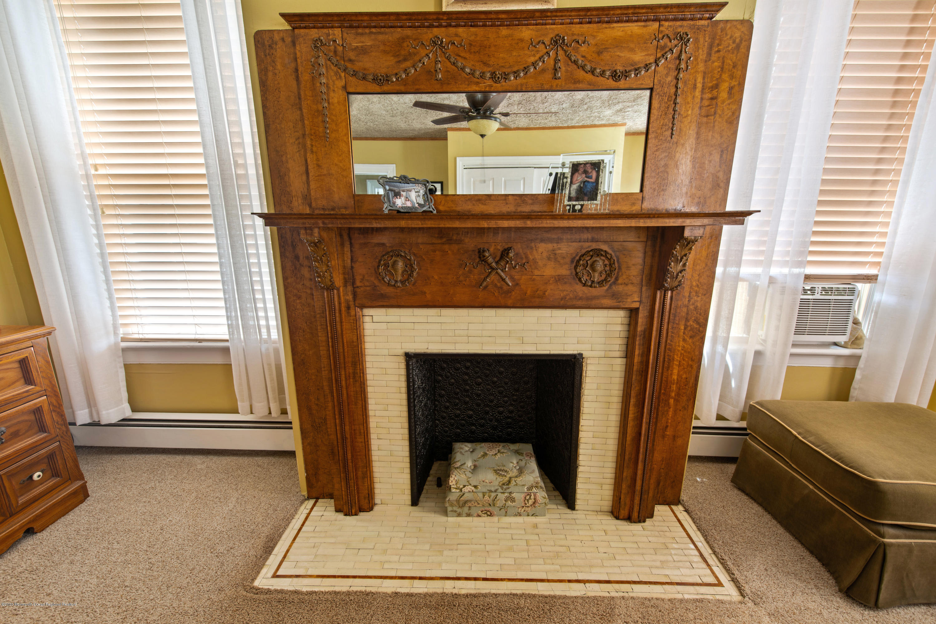 205 Main Street Keyport, NJ 07735 - Photo 27 of 42 a living room with a fireplace windows and a table