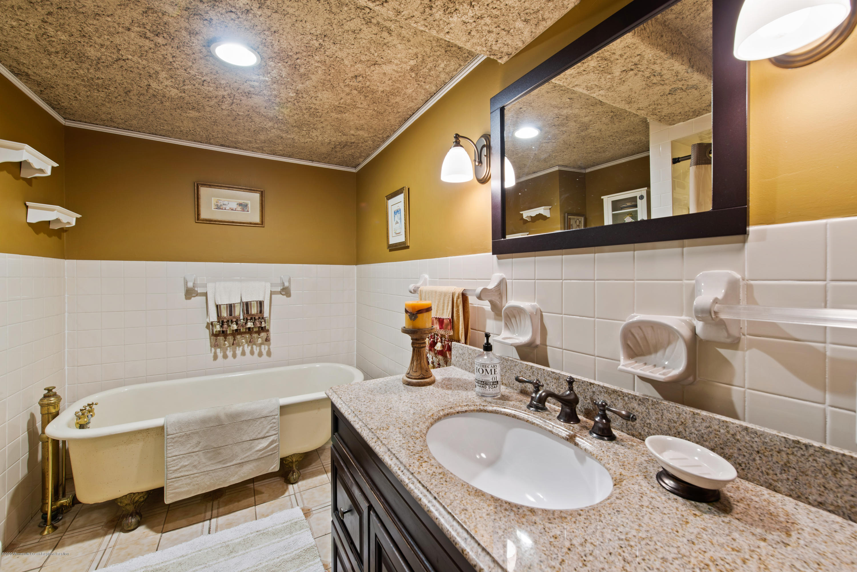 205 Main Street Keyport, NJ 07735 - Photo 29 of 42 a bathroom with a granite countertop sink a mirror and a
