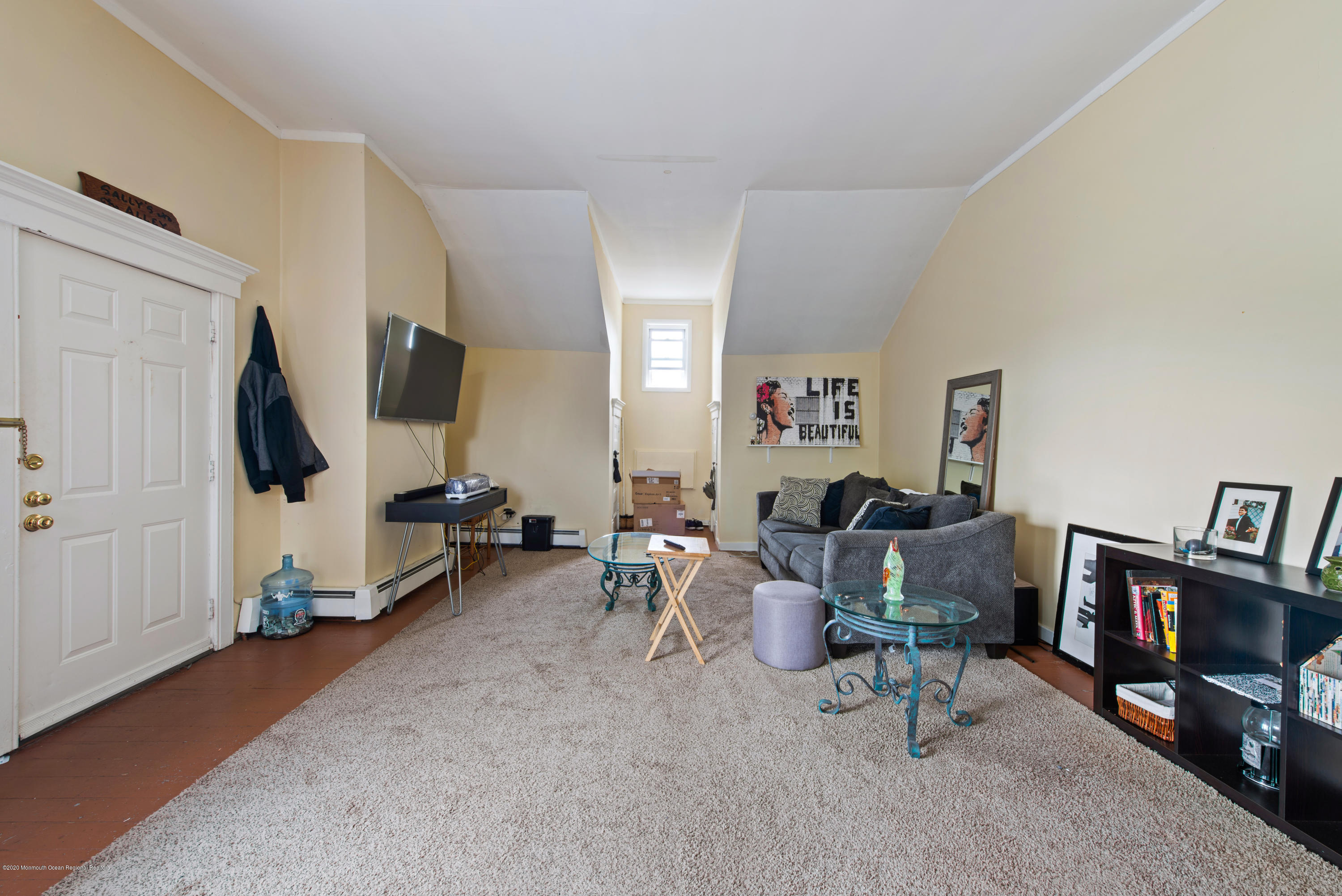 205 Main Street Keyport, NJ 07735 - Photo 35 of 42 a living room with furniture a window and a flat screen tv
