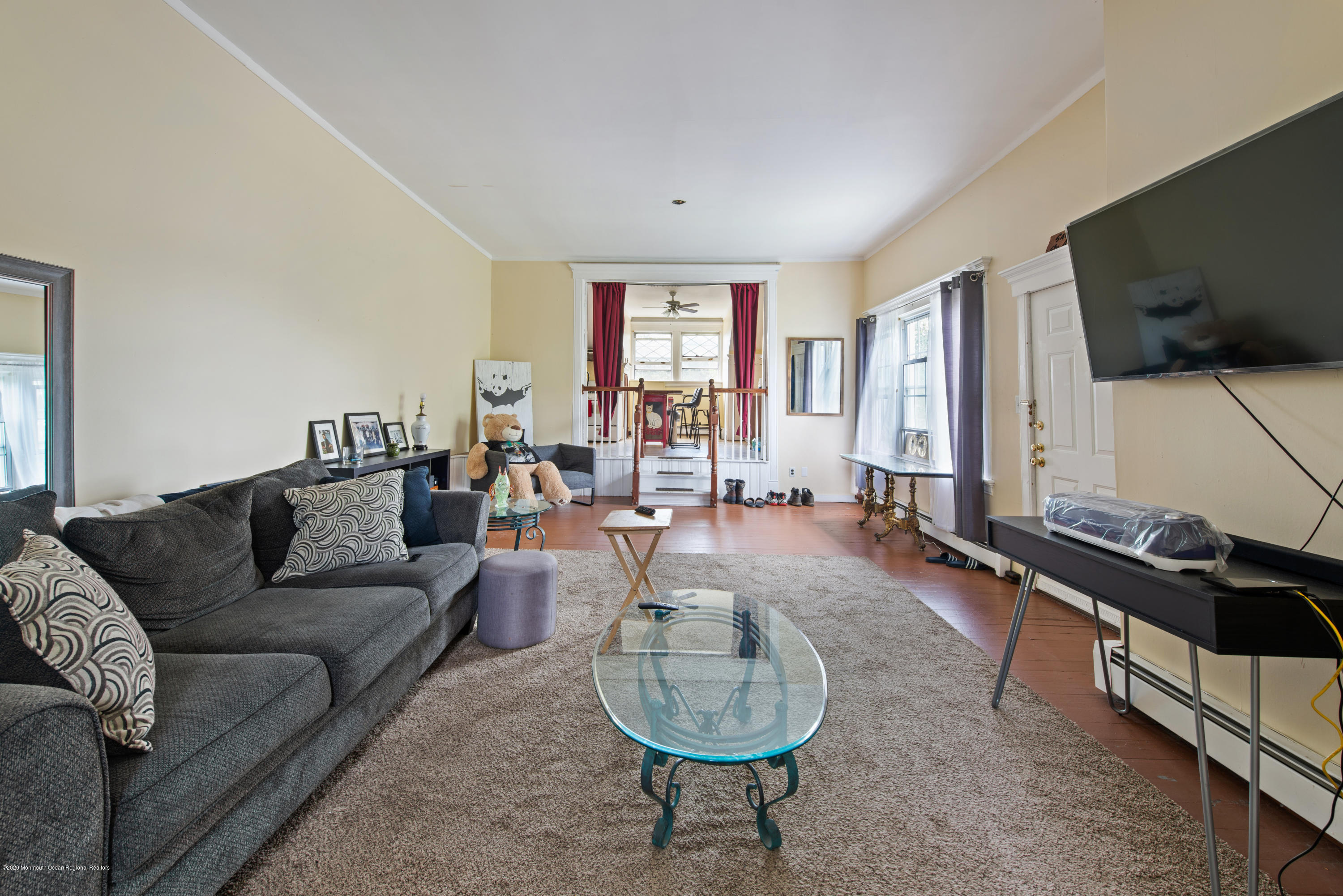 205 Main Street Keyport, NJ 07735 - Photo 36 of 42 a living room with furniture a flat screen tv and a window
