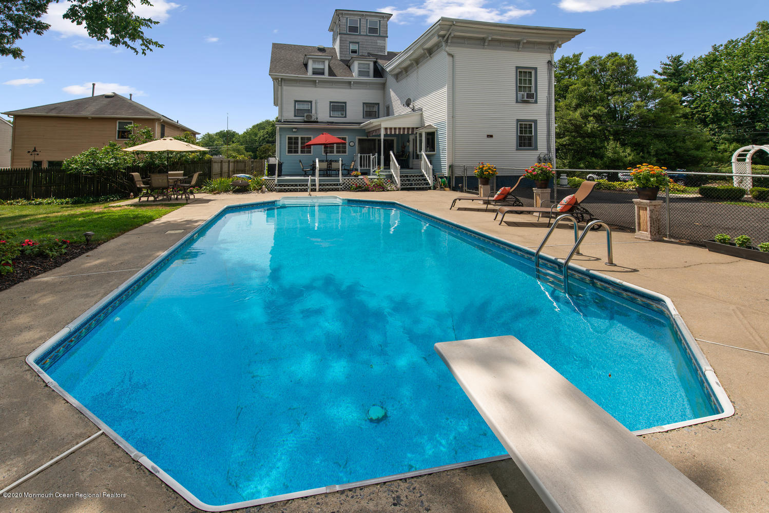 205 Main Street Keyport, NJ 07735 - Photo 37 of 42 a view of a swimming pool with lounge chairs in patio