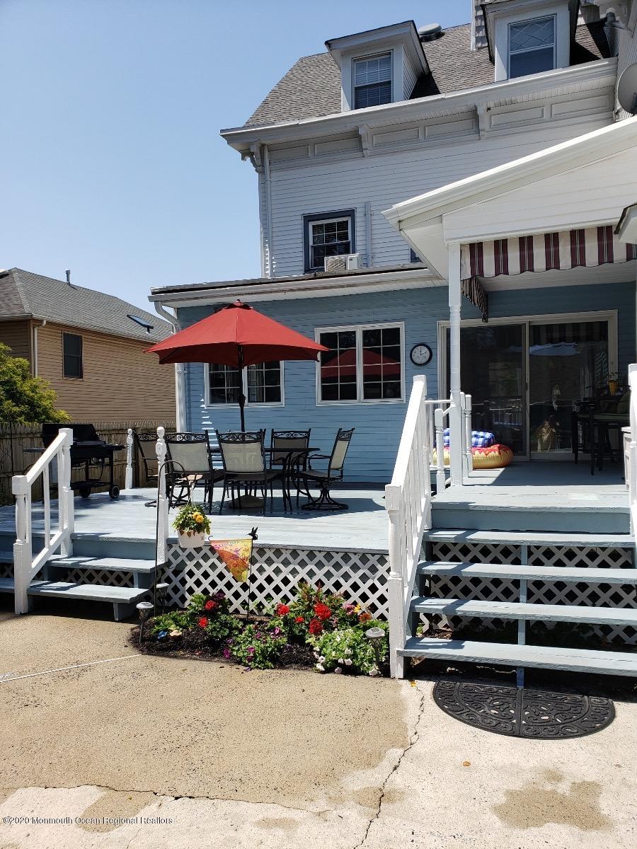 205 Main Street Keyport, NJ 07735 - Photo 41 of 42 a front view of a building with lots of green space