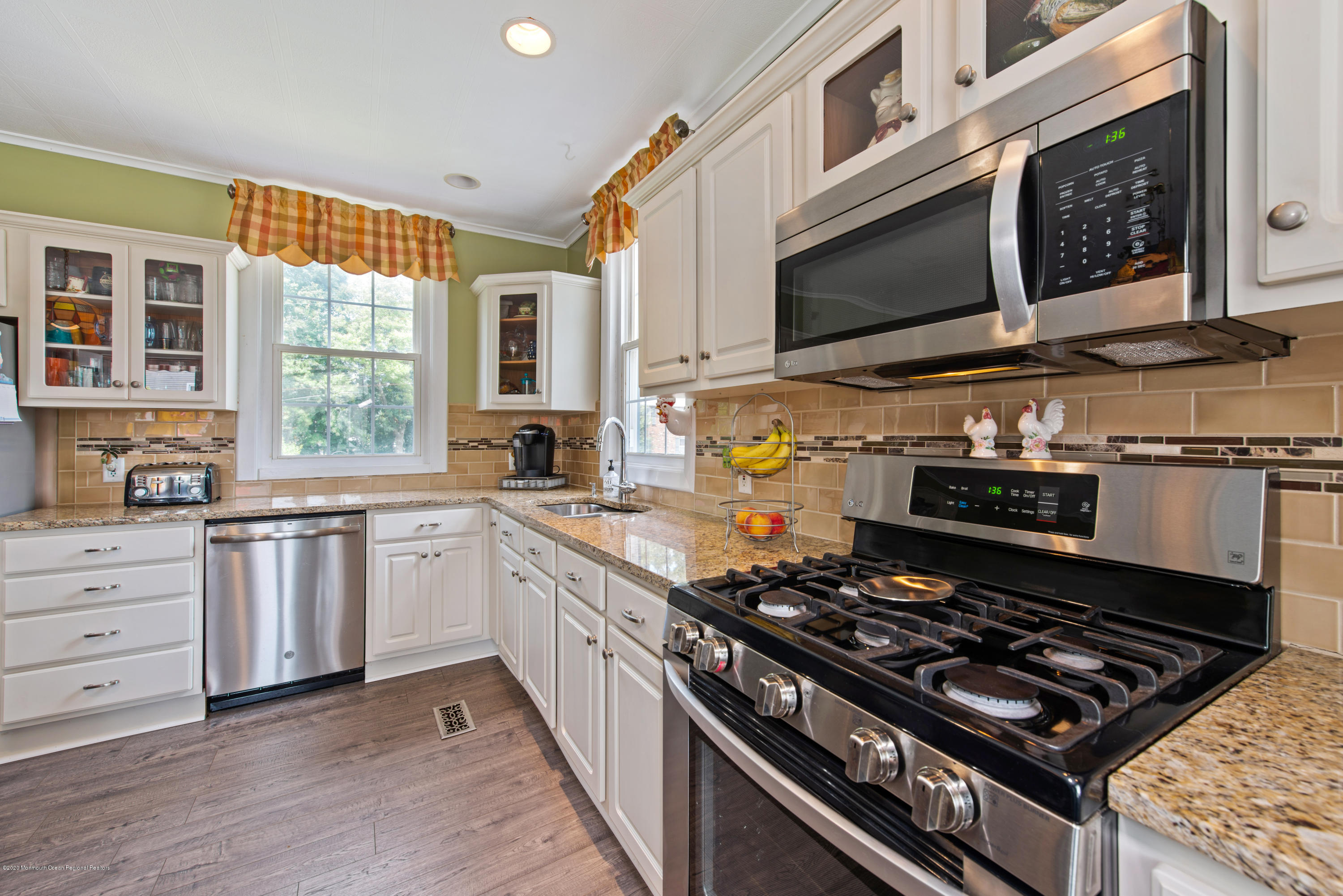 205 Main Street Keyport, NJ 07735 - Photo 10 of 42 a kitchen with stainless steel appliances granite countertop a stove and a microwave