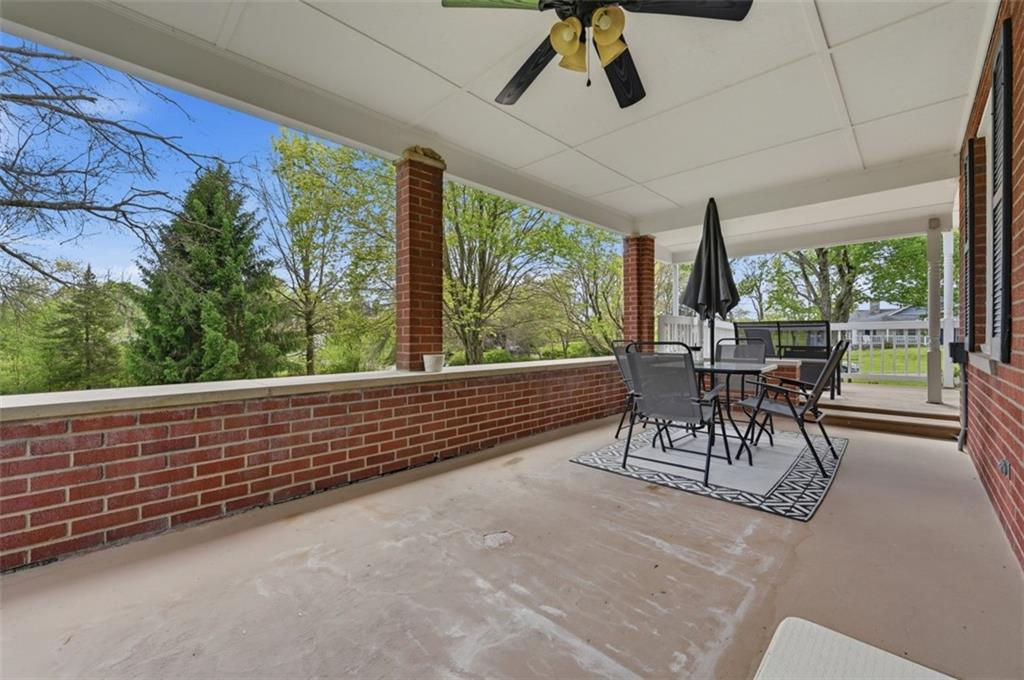 129 Meadowbrook Road Renfrew, PA 16053 - Photo 27 of 45 a view of a patio with a table and chairs