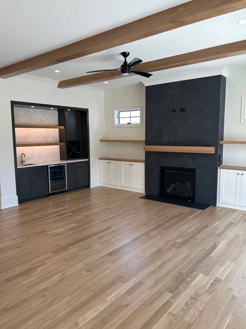 1413 Brophy Avenue Park Ridge, IL 60068 - Photo 11 of 34 a view of empty room with wooden floor and fireplace