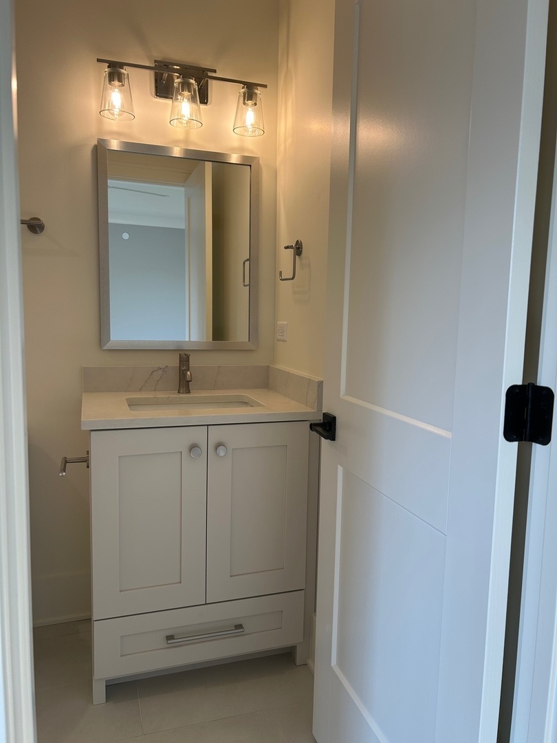 1413 Brophy Avenue Park Ridge, IL 60068 - Photo 23 of 34 a bathroom with a sink and a mirror