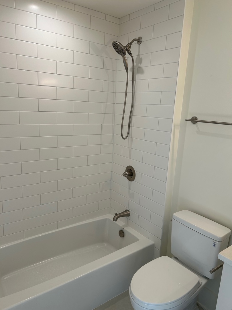1413 Brophy Avenue Park Ridge, IL 60068 - Photo 24 of 34 a white toilet and tub sitting next to a bathroom sink