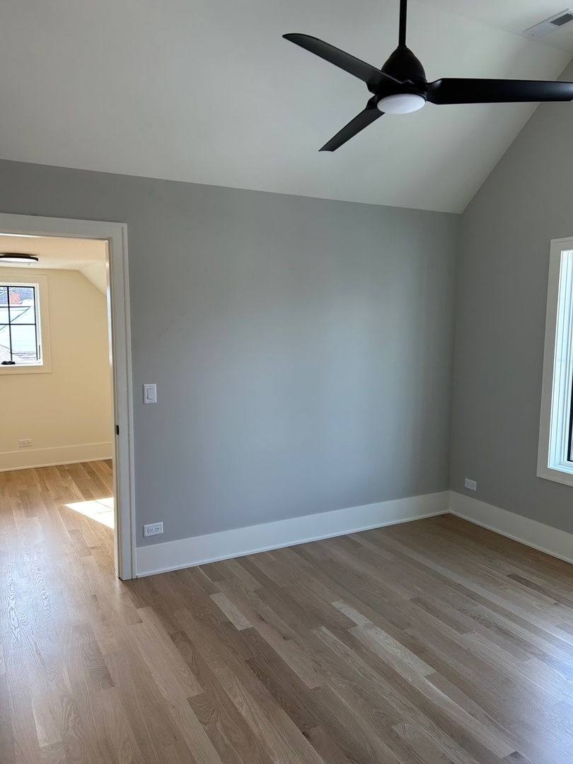 1413 Brophy Avenue Park Ridge, IL 60068 - Photo 25 of 34 wooden floor in an empty room with a window
