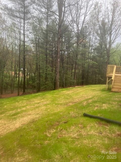 2490 Shadowbrook Drive Lenoir, NC 28645 - Photo 25 of 25 a view of a swimming pool with an outdoor space and seating area