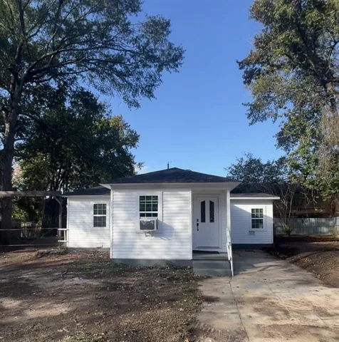 a house with trees in the background