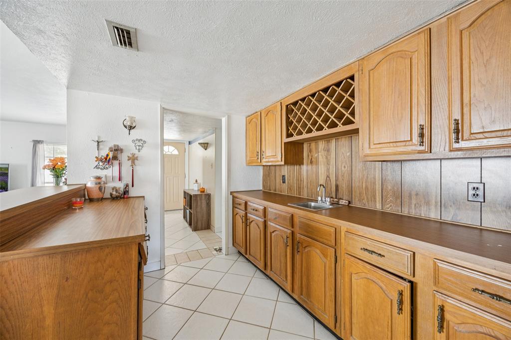 3113 Ridgemoor Drive Garland, TX 75044 - Photo 16 of 30 a kitchen with stainless steel appliances granite countertop a refrigerator and a stove