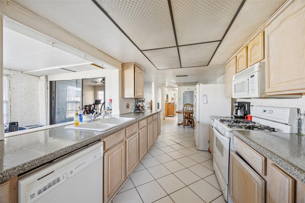 3113 Ridgemoor Drive Garland, TX 75044 - Photo 19 of 30 a kitchen with lots of counter top space and appliances