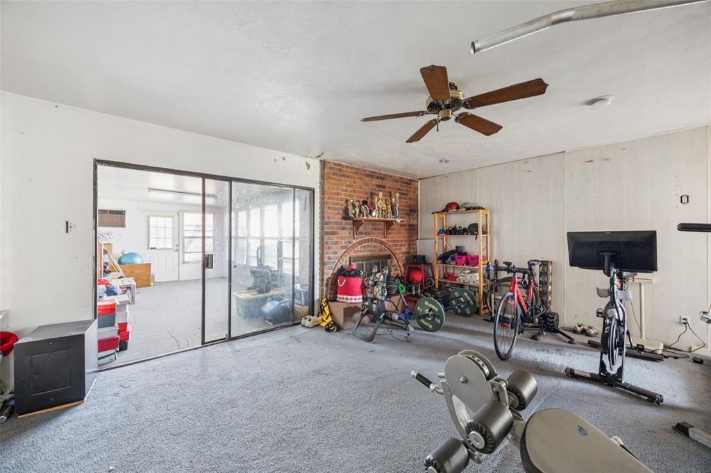 3113 Ridgemoor Drive Garland, TX 75044 - Photo 22 of 30 a view of a room with gym equipment
