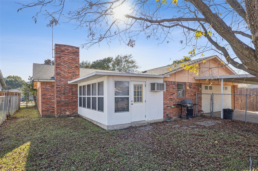 3113 Ridgemoor Drive Garland, TX 75044 - Photo 28 of 30 a view of a house with a yard