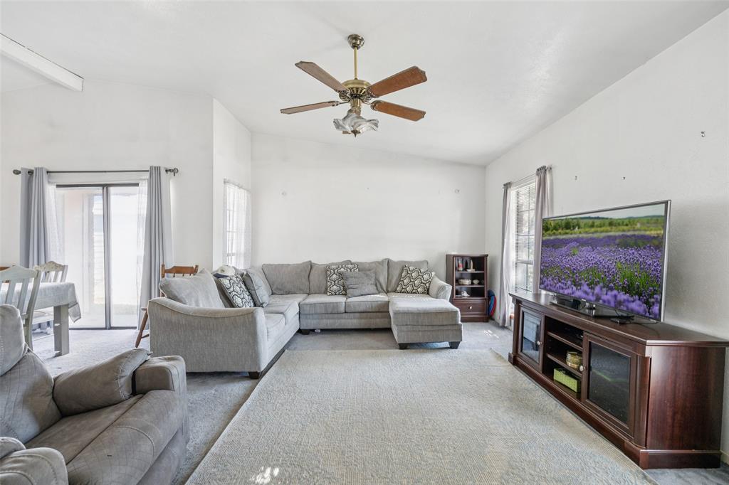 3113 Ridgemoor Drive Garland, TX 75044 - Photo 5 of 30 a living room with furniture and a flat screen tv