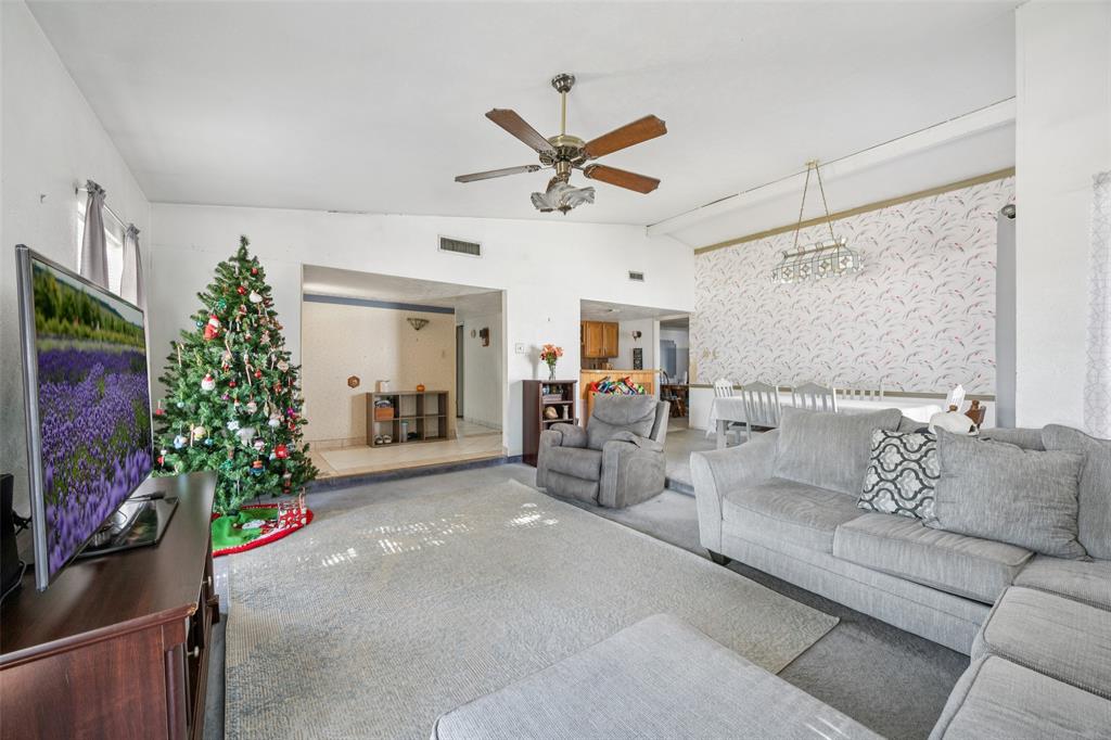 3113 Ridgemoor Drive Garland, TX 75044 - Photo 7 of 30 a living room with furniture a potted plant and a flat screen tv