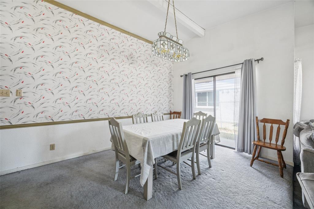 3113 Ridgemoor Drive Garland, TX 75044 - Photo 8 of 30 a view of a dining room with furniture and a chandelier