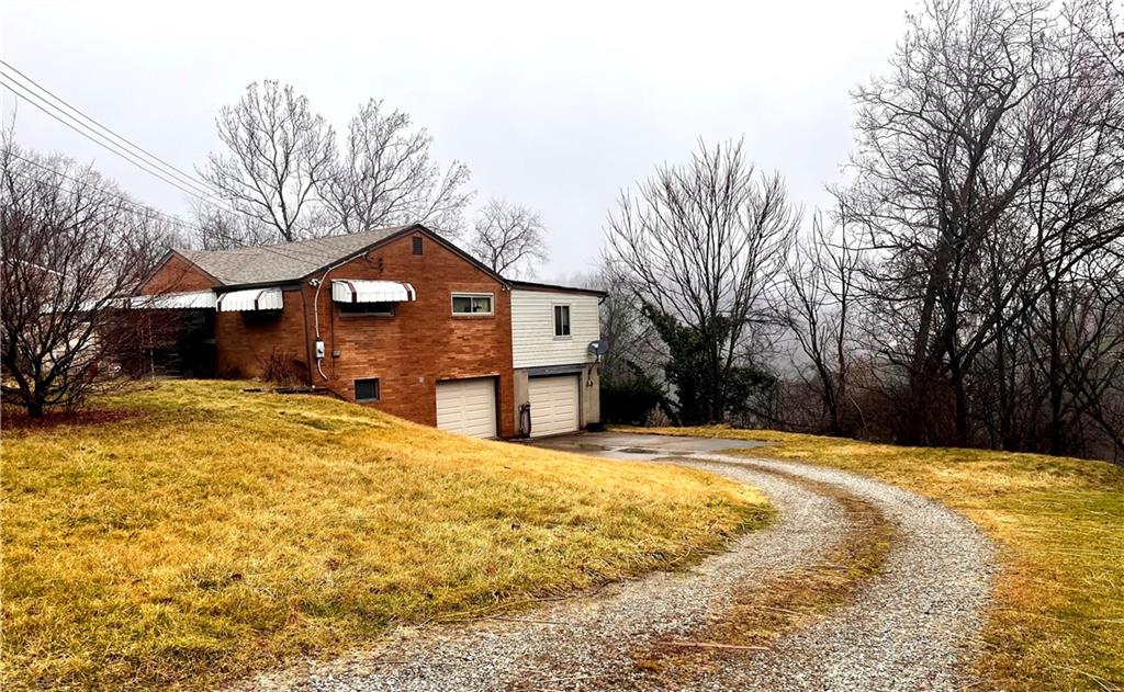 3531 Bevan Road North Versailles, PA 15137 - Photo 3 of 23 Large side yard with private drive and two car garage.