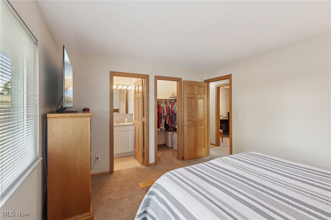 5877 Pearl Road Cleveland, OH 44130 - Photo 19 of 42 Bedroom featuring light carpet and a spacious closet