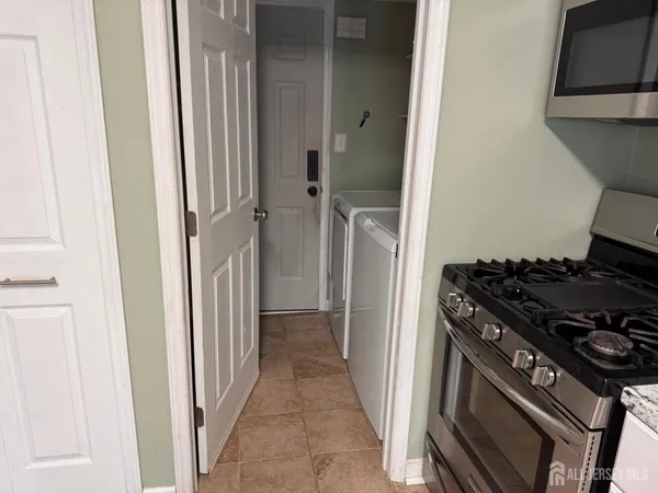 a kitchen with a stove and a refrigerator