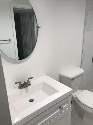 a bathroom with a sink and a toilet