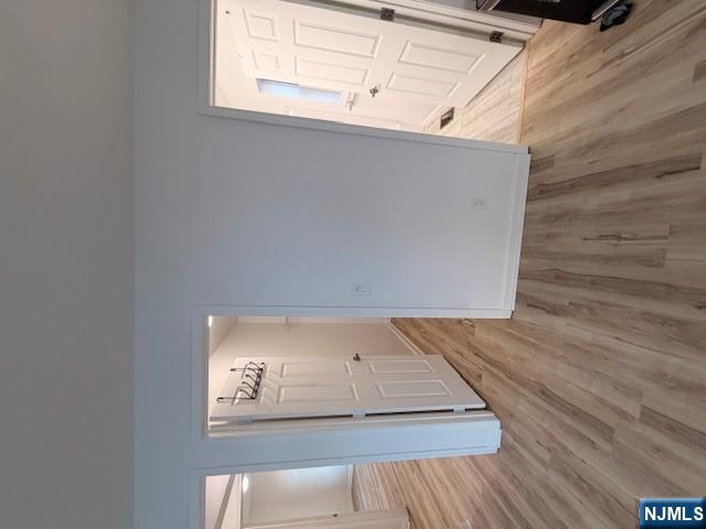 65 Barbour Street, Unit 1 Haledon, NJ 07508 - Photo 12 of 18 wooden floor in an empty room