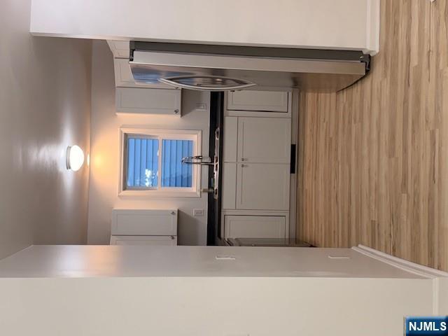 65 Barbour Street, Unit 1 Haledon, NJ 07508 - Photo 4 of 18 a kitchen with stainless steel appliances granite countertop a refrigerator and a sink