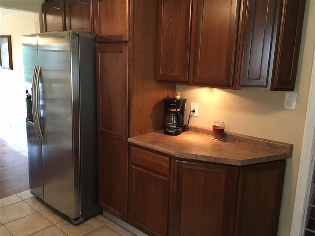 3724 Middleboro Road Castle Shannon, PA 15234 - Photo 11 of 25 A large pantry surrounds the stainless steel refrigerator and provides another source of counter space.