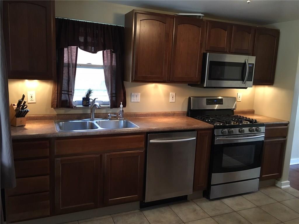 3724 Middleboro Road Castle Shannon, PA 15234 - Photo 9 of 25 The counter is extended to both sides of the gas oven making cooking in the kitchen a breeze!