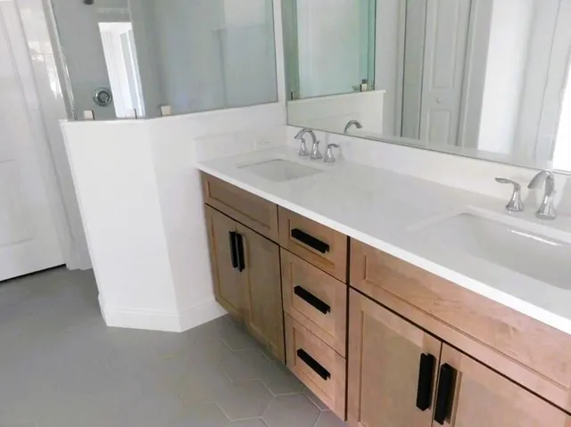 a bathroom with a sink and a mirror