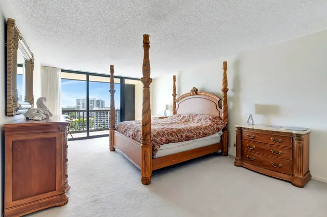 a bedroom with a bed and dresser