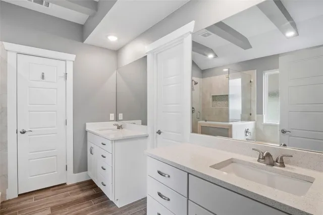 a bathroom with a bathtub and a shower