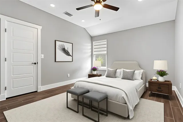 a bedroom with a bed and window